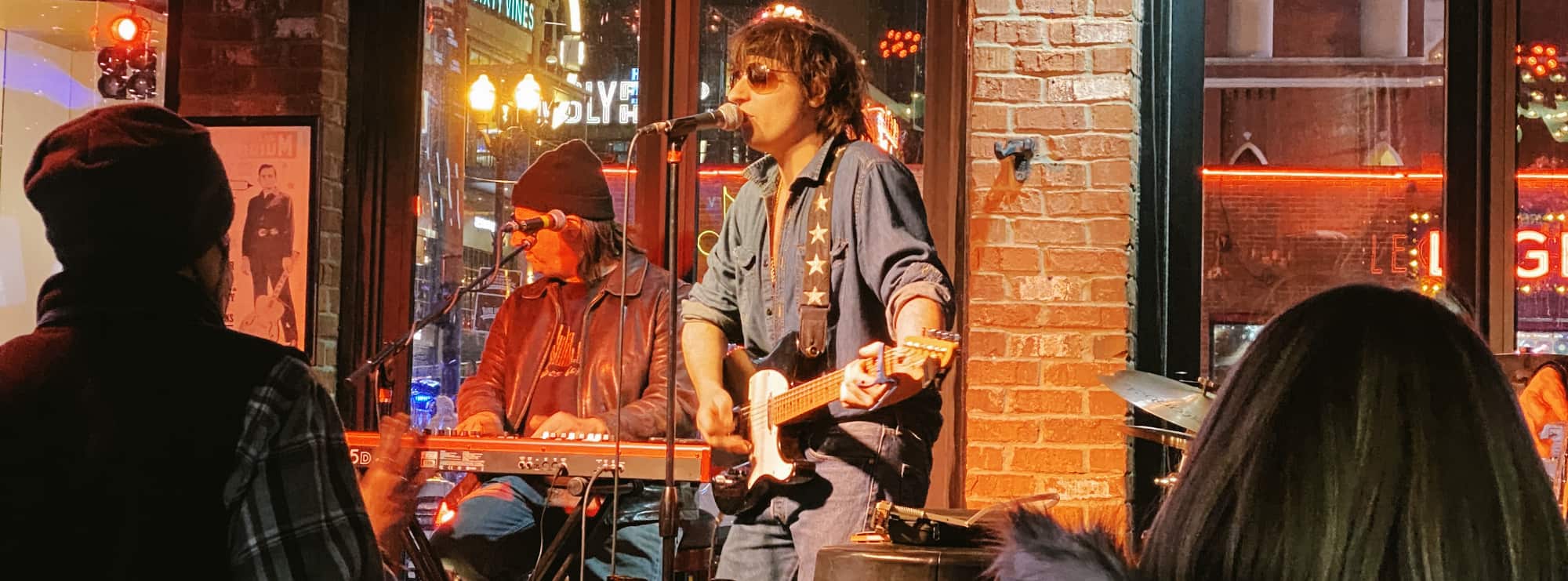 bar singer on guitar in Jackson