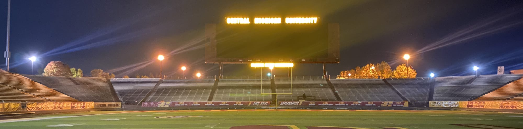 empty football stadium at night under the lights Jackson
